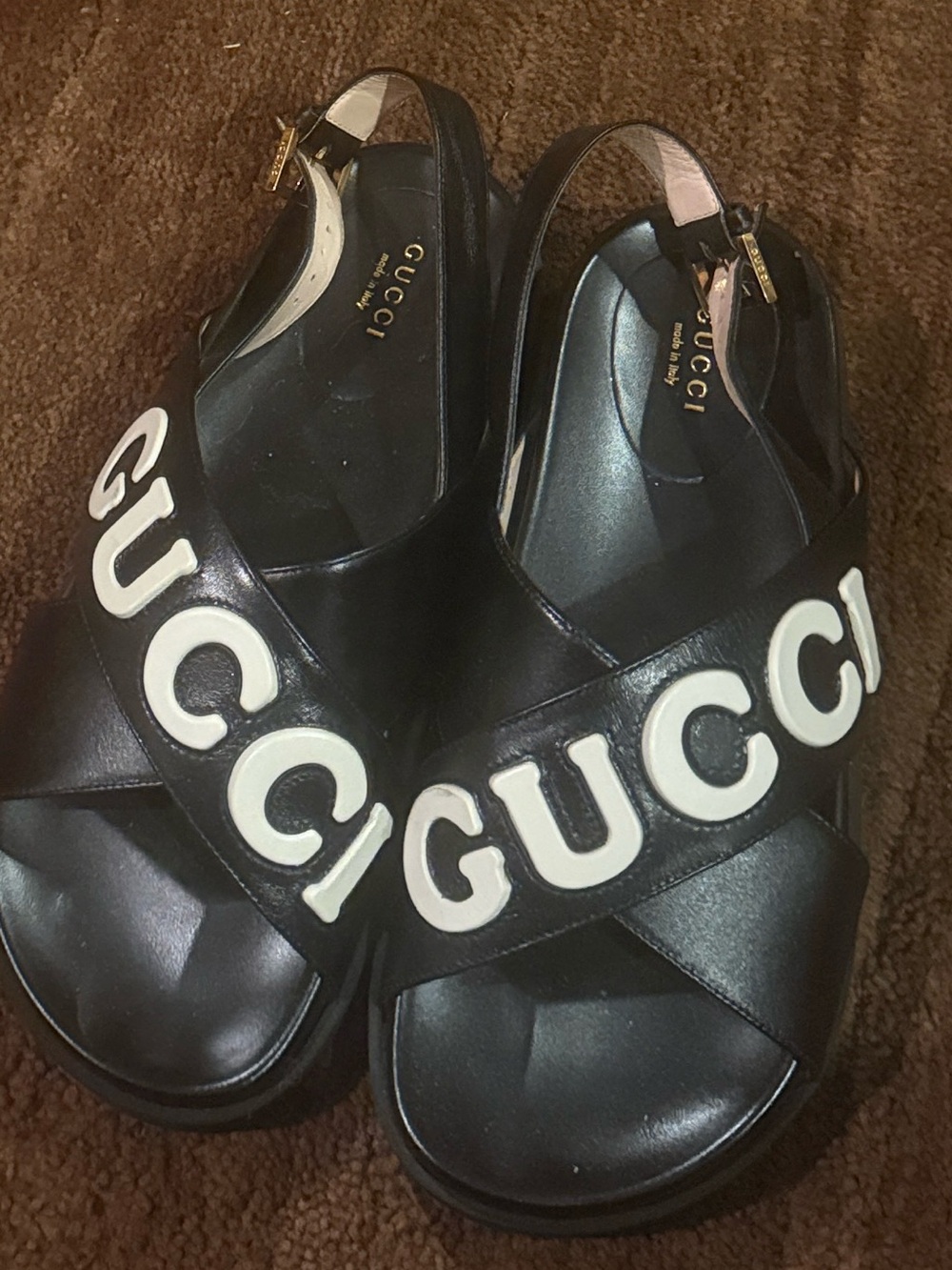 Gucci Black women’s Logo Cross-Strap Sandals with White Lettering